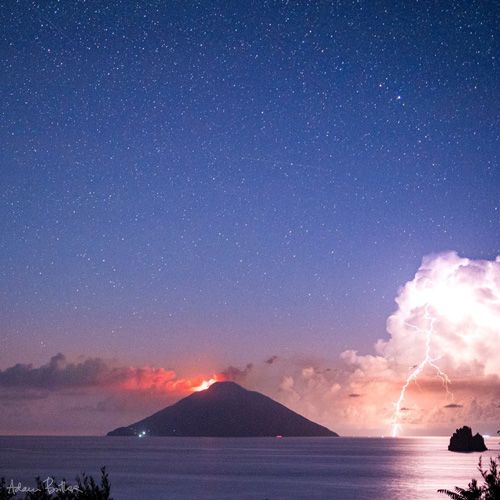 1st Place A terrific thunderstorm beside the erupting volcanic island of Stromboli, off Sicily by Adam Butler @adambutler65
